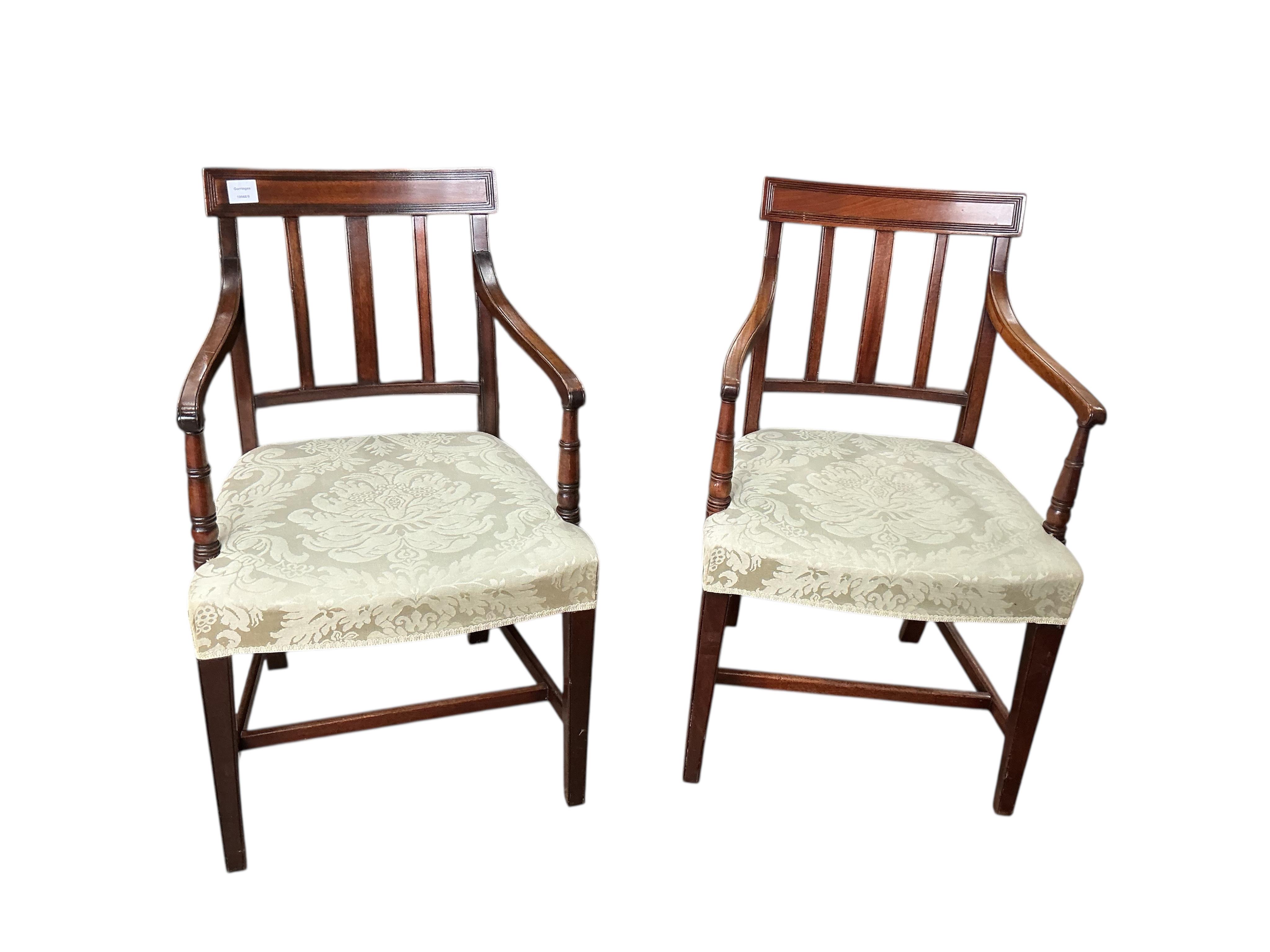 A set of six George III style mahogany dining chairs, two with arms